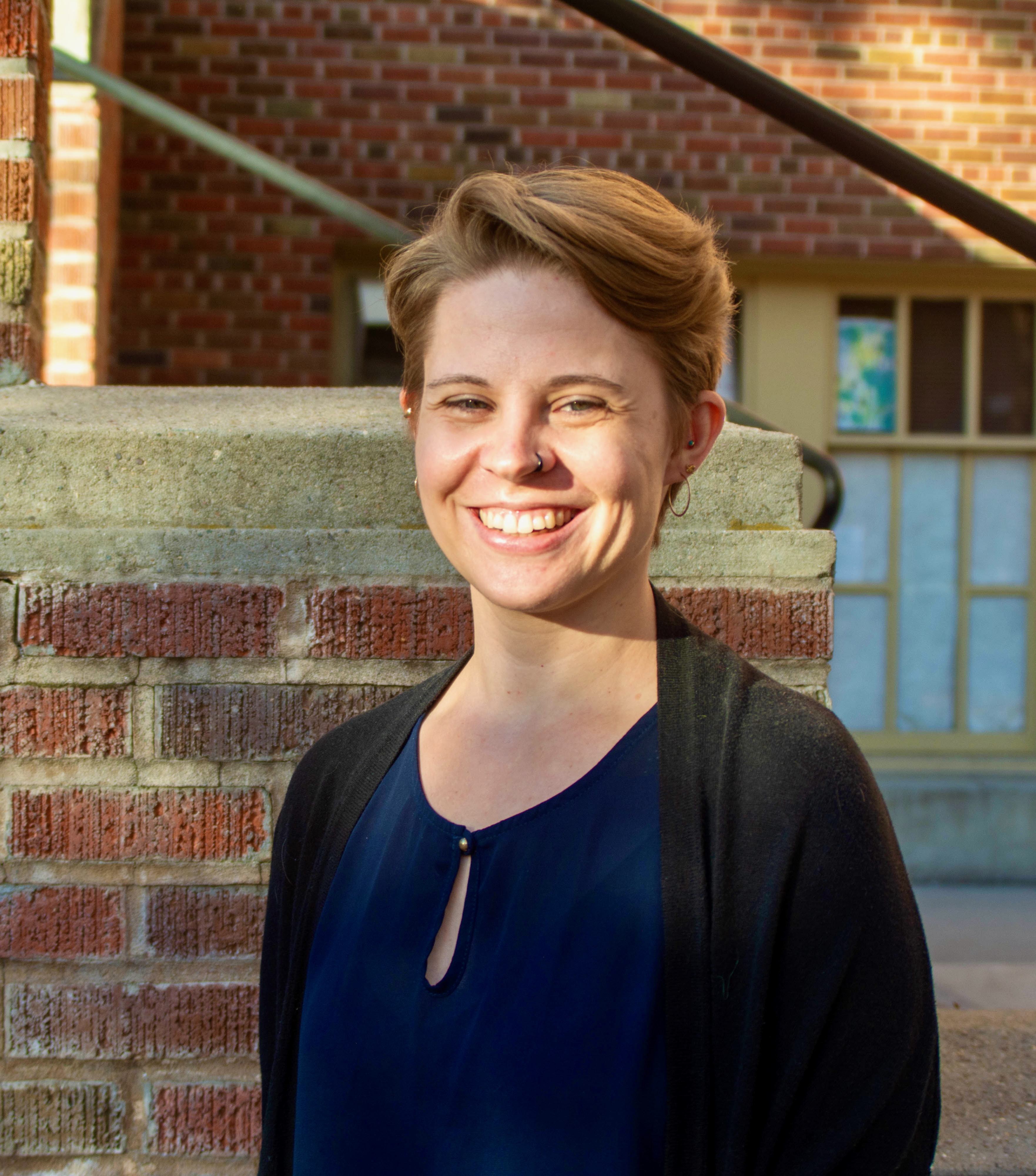 image of Jessie in front of a brick building